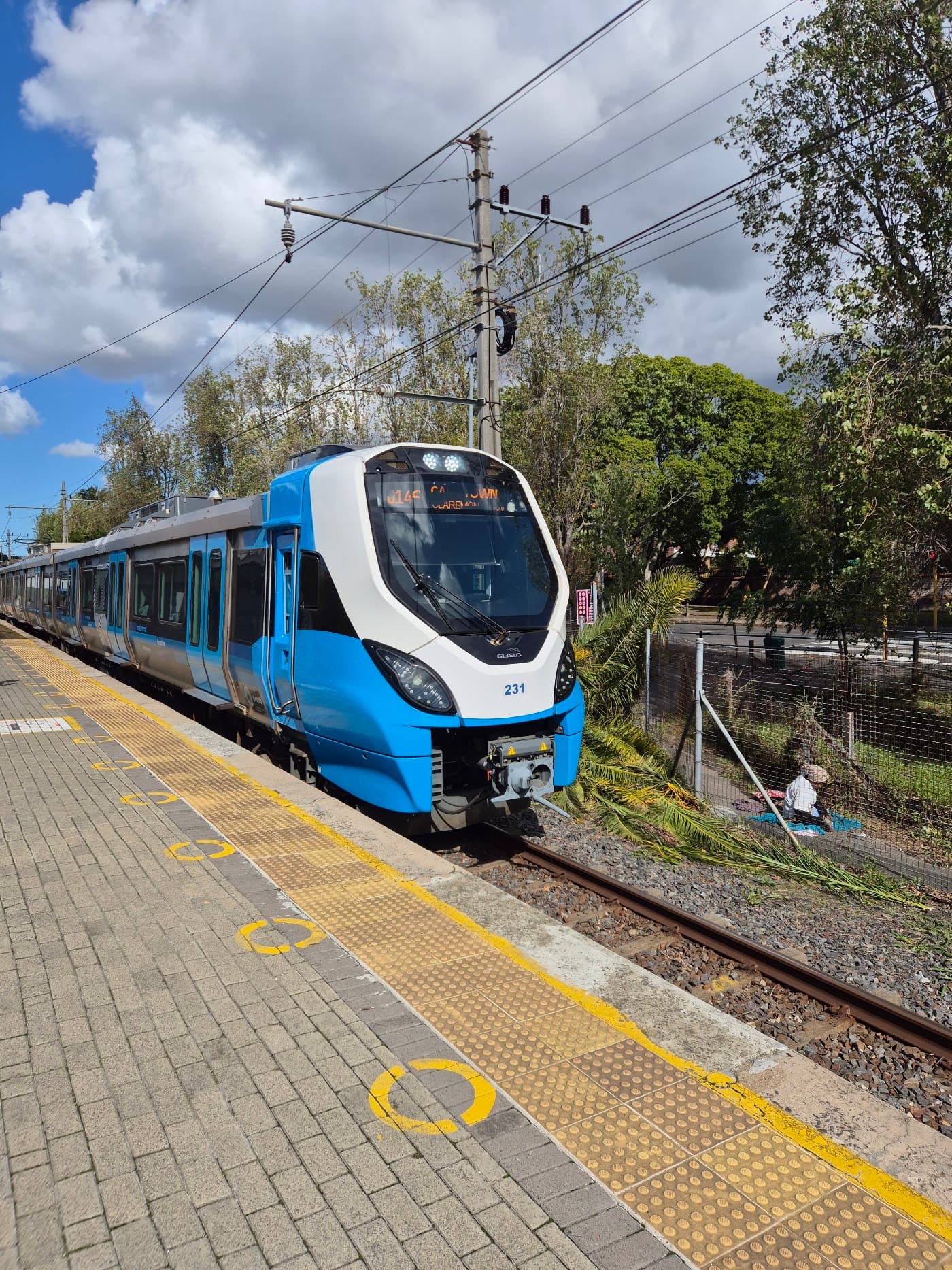 A Metrorail train bound for Cape Town via Claremont pulling into a platform