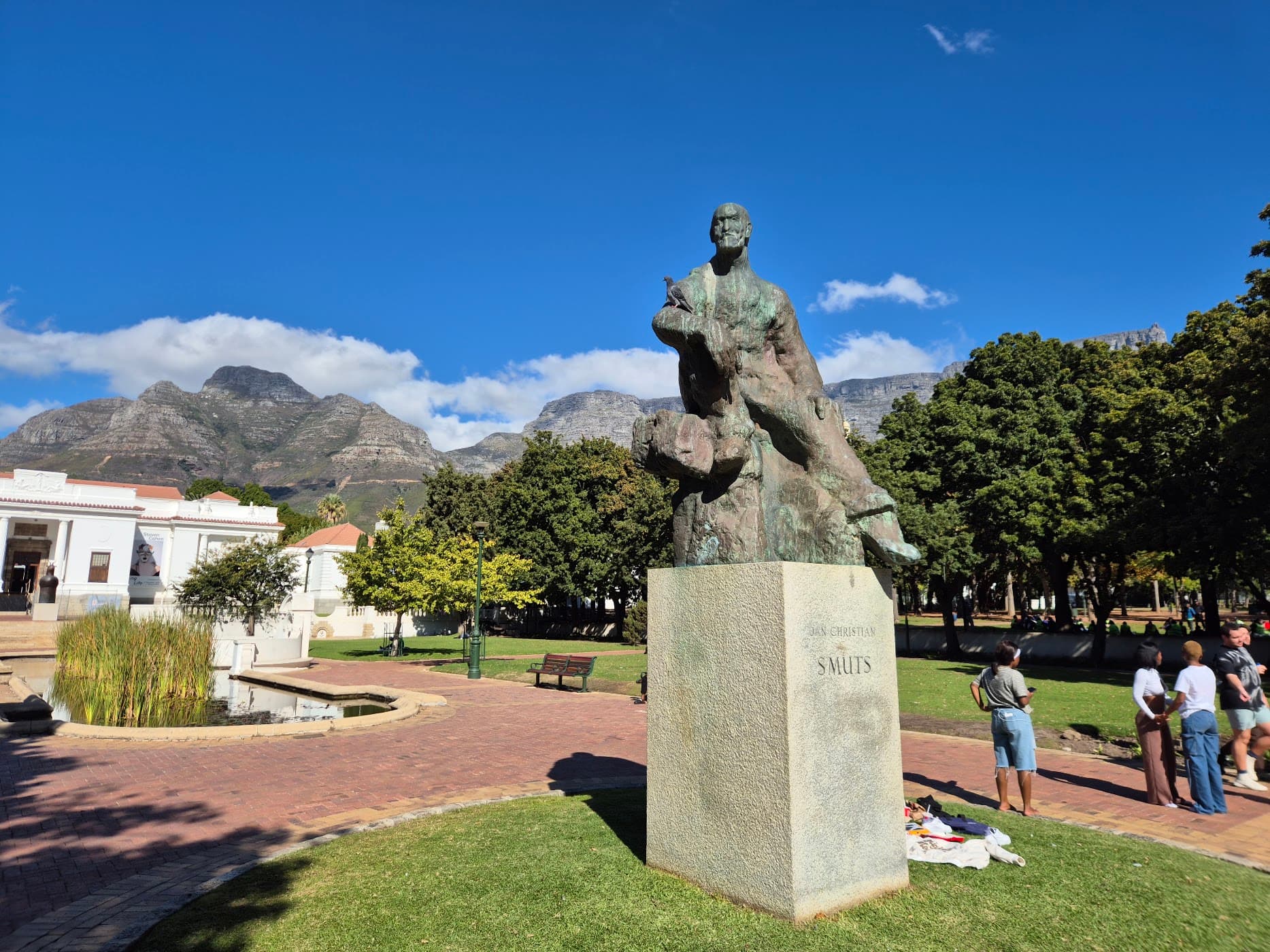 A statue in a public garden with Table Mountain behind