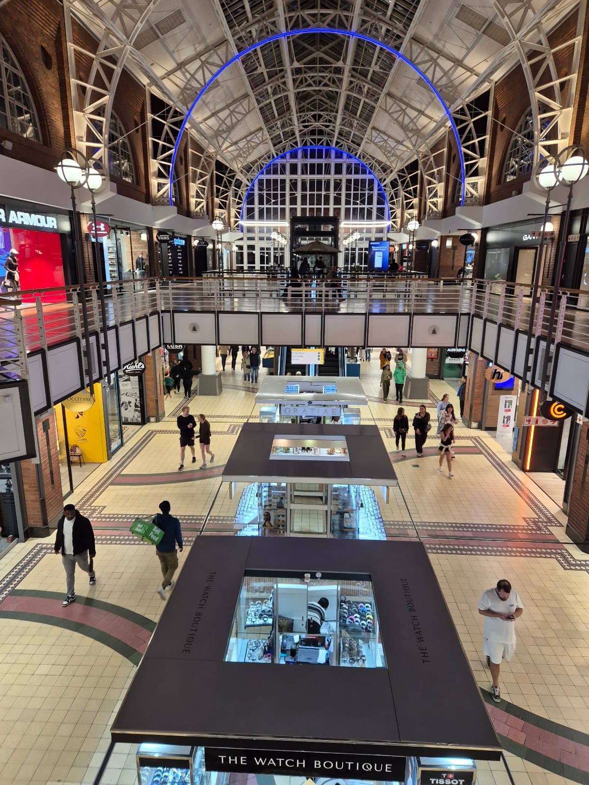 The interior atrium of a modern shopping mall