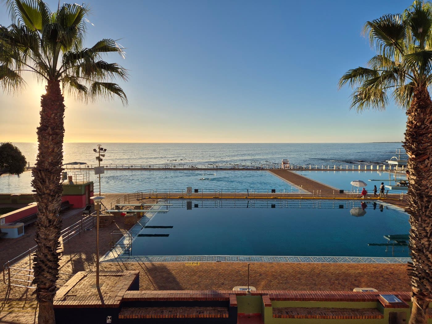 Sea Point Pavilion tidal pools at sunset, looking out over the Atlantic