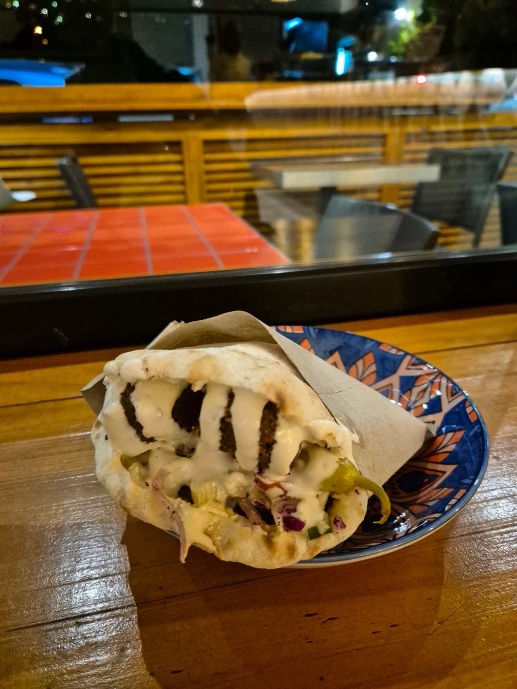A shawarma wrap on a plate at a Cape Town restaurant