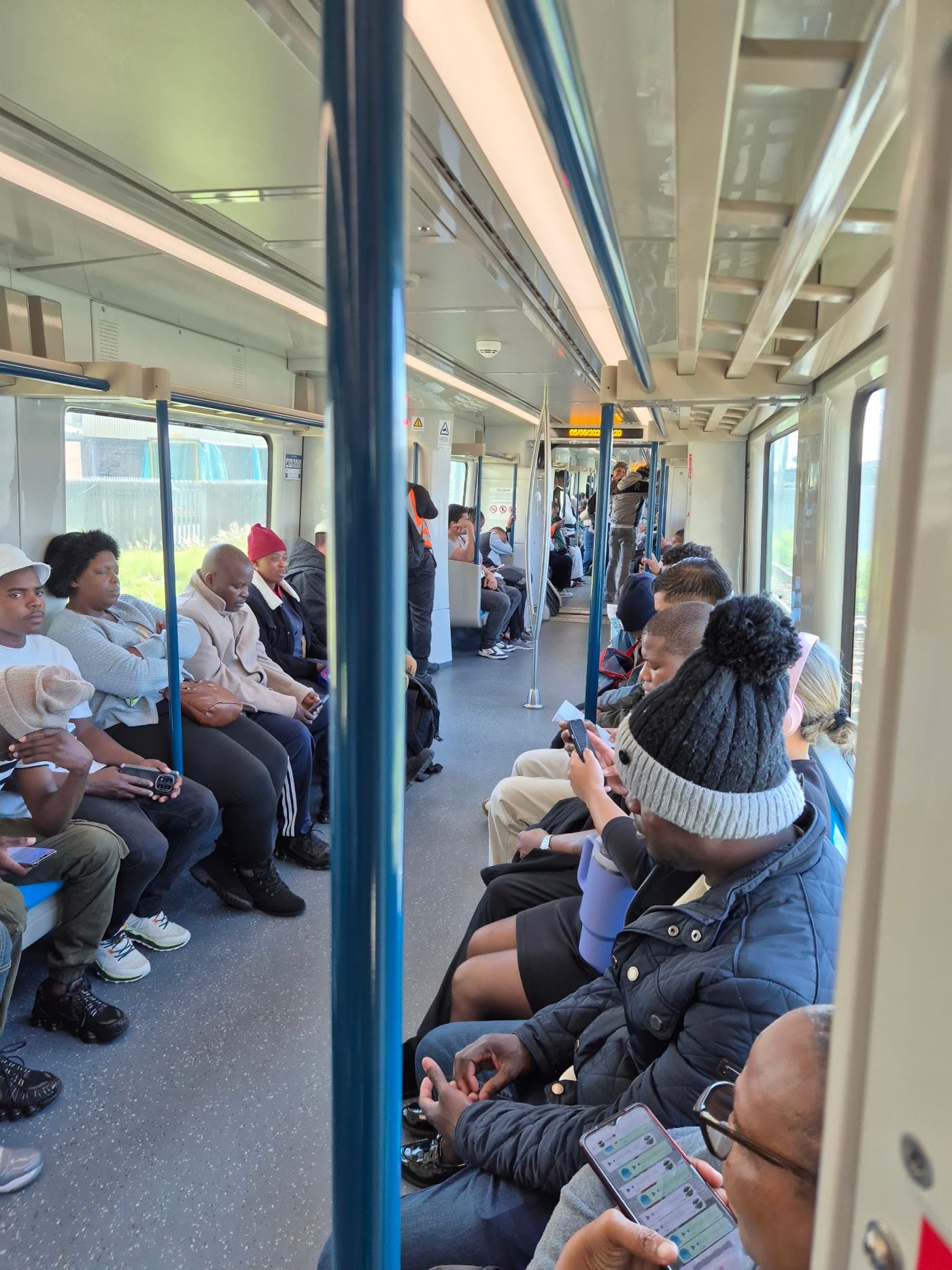 Commuters seated inside a Metrorail carriage